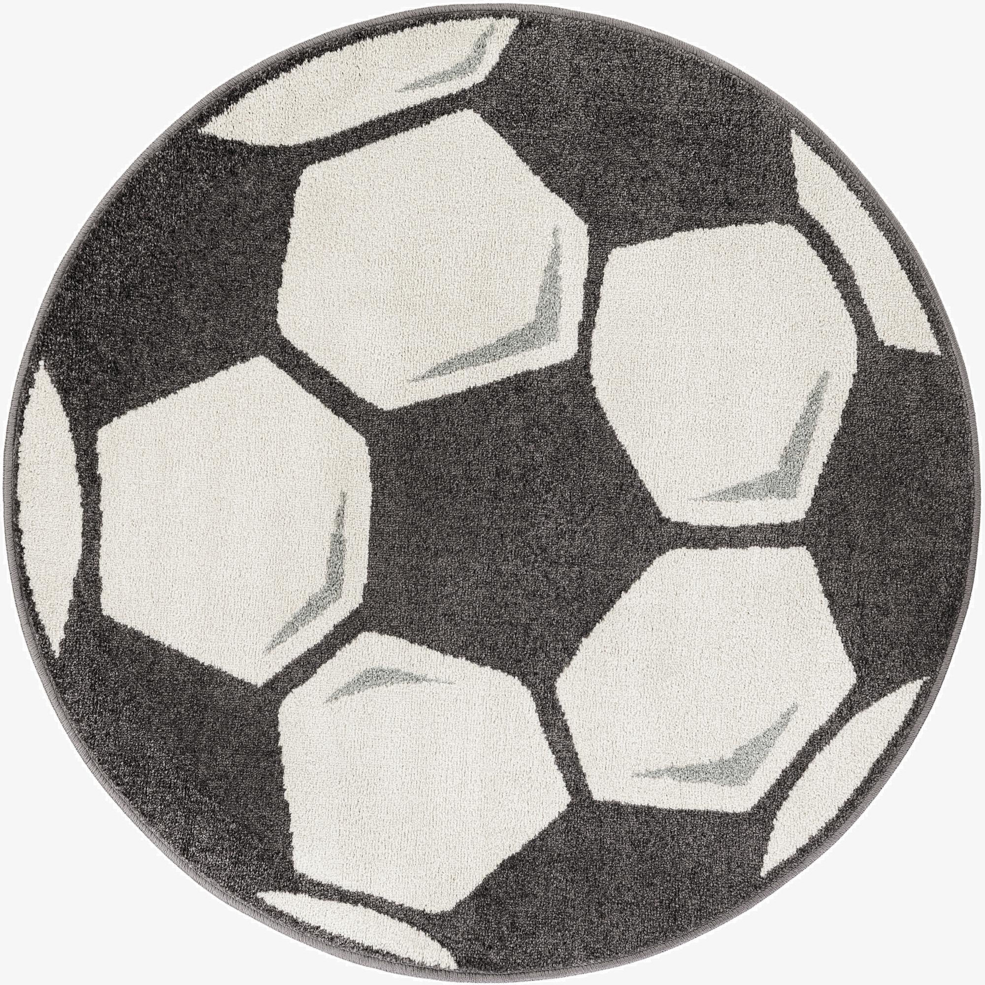 A round 4' 0 x 4' 0 black and white rug featuring a modern soccer ball pattern, perfect for a child's room.