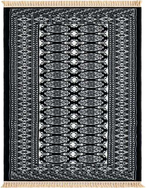 A black and white Bokhara runner rug with intricate traditional patterns and cream fringes, ideal for hallways.