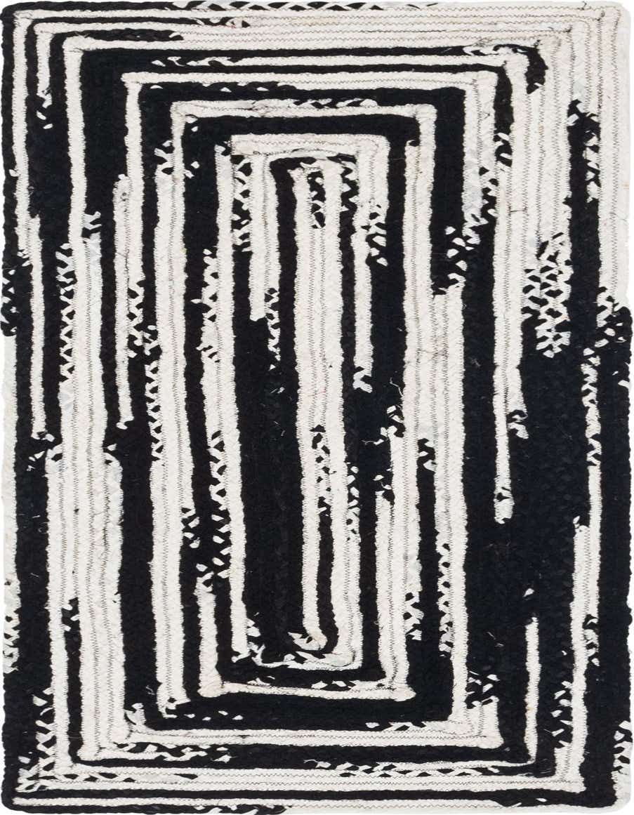 A 6 ft runner rug with a bold black and white abstract striped pattern, made from braided cotton.