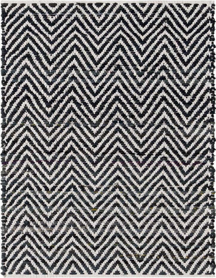A 6 ft runner rug with a bold black and white chevron pattern, featuring a textured, flatweave cotton construction.