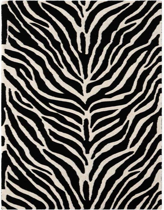 A 10 ft runner rug featuring a bold black and white zebra stripe pattern with a high, textured pile, perfect for a modern hallway.