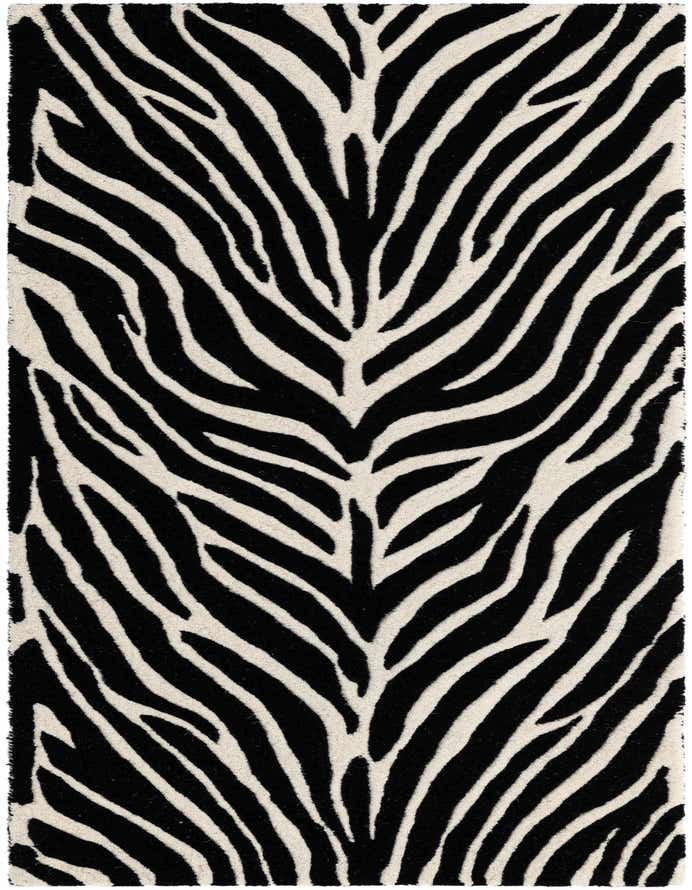 A close-up of a black and white zebra print runner rug with a high, textured pile, ideal for a hallway.