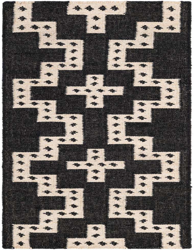 A 6 ft runner rug with a bold black and ivory tribal geometric pattern, ideal for a hallway or kitchen.