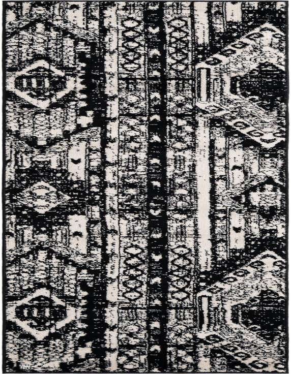 A black and white 8 ft runner rug with a distressed Bohemian and tribal pattern, ideal for a hallway.