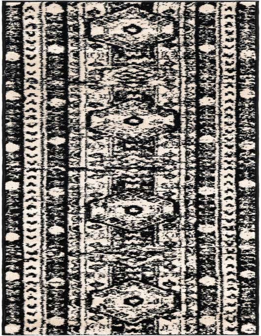 A black and ivory 8 ft runner rug with a distressed Bohemian tribal pattern, ideal for a hallway.