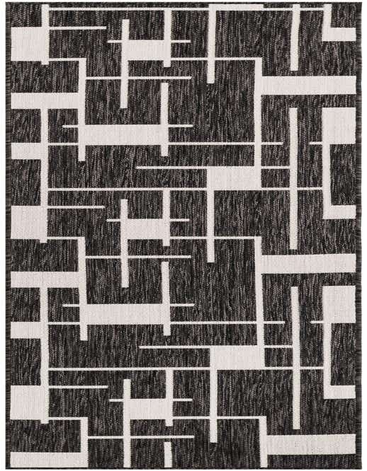 A black and white modern geometric runner rug with a maze-like pattern, suitable for a hallway or patio.