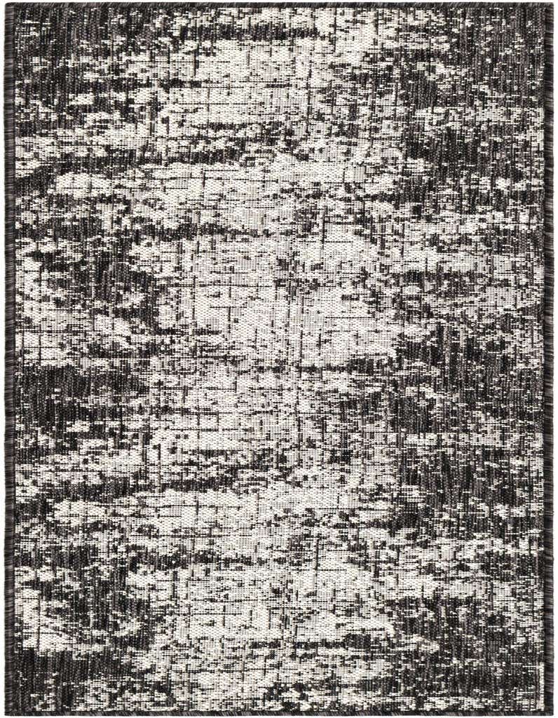 A 5 ft runner rug from the Outdoor Modern collection, featuring an abstract black and white distressed pattern, suitable for hallways or patios.