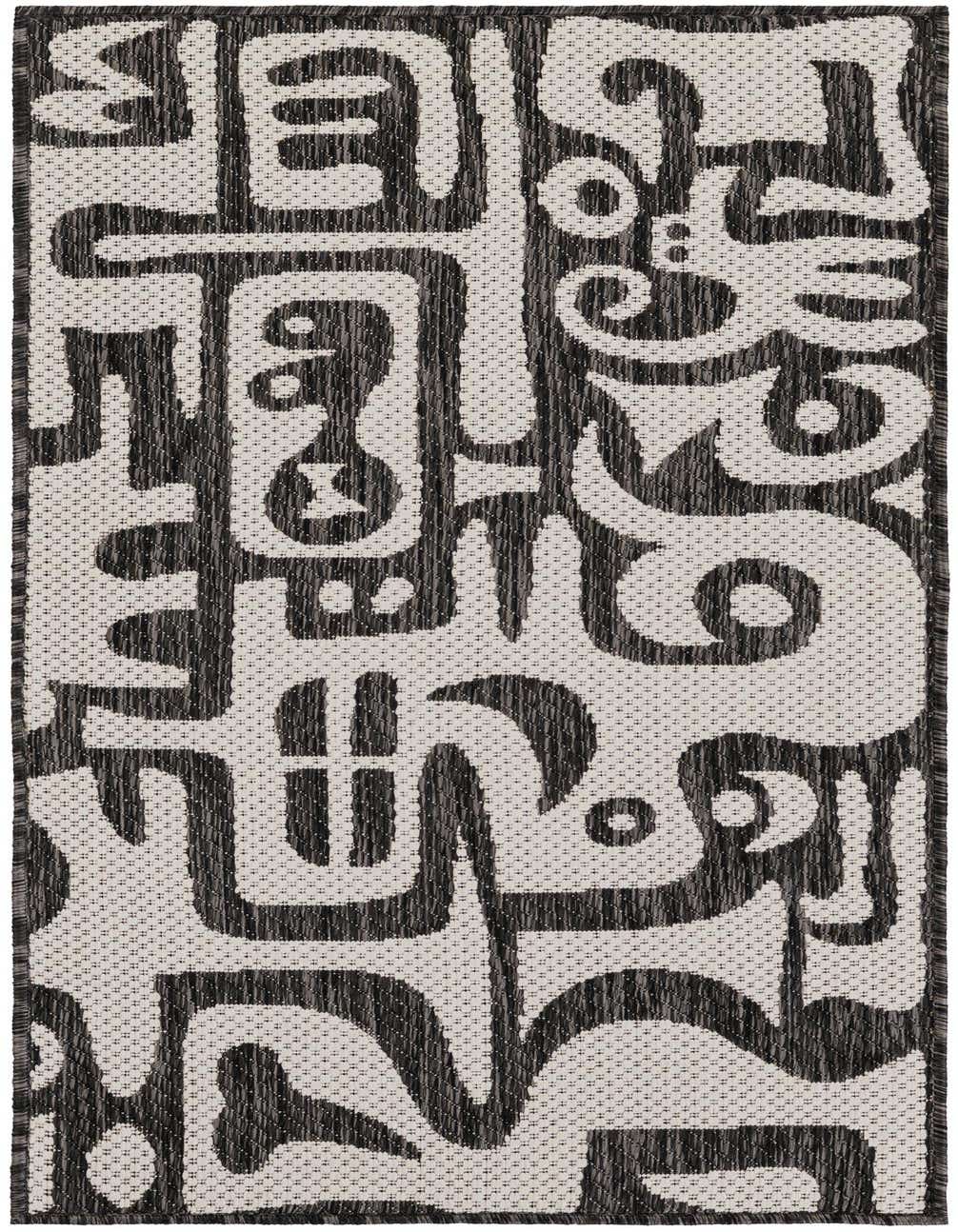 A 4 ft runner rug featuring a bold black and white abstract pattern, suitable for hallways or patios.