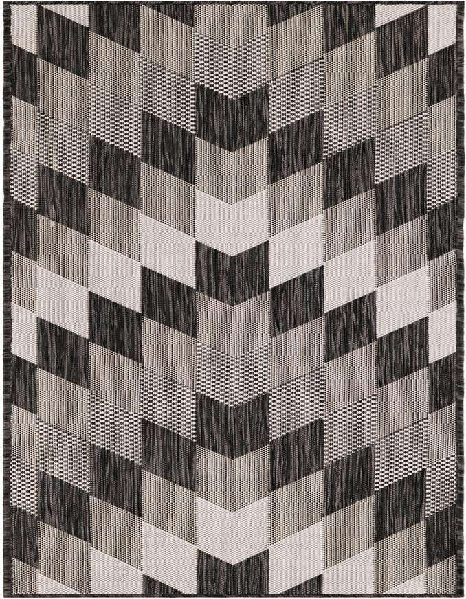 A black and white tribal geometric runner rug with a zigzag pattern, suitable for a hallway or patio.