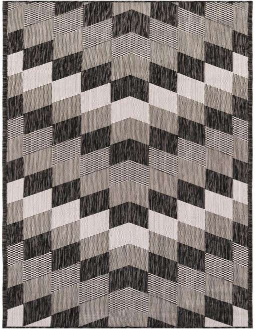 A black and white tribal pattern runner rug with a modern geometric chevron design, ideal for a hallway or patio.
