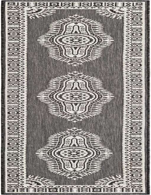 A black and white 8 ft runner rug with a traditional medallion pattern, ideal for a hallway or patio.