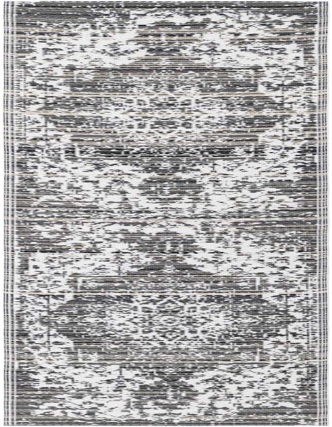 A 6 ft runner rug with a distressed black and white traditional medallion pattern, ideal for a hallway or patio.