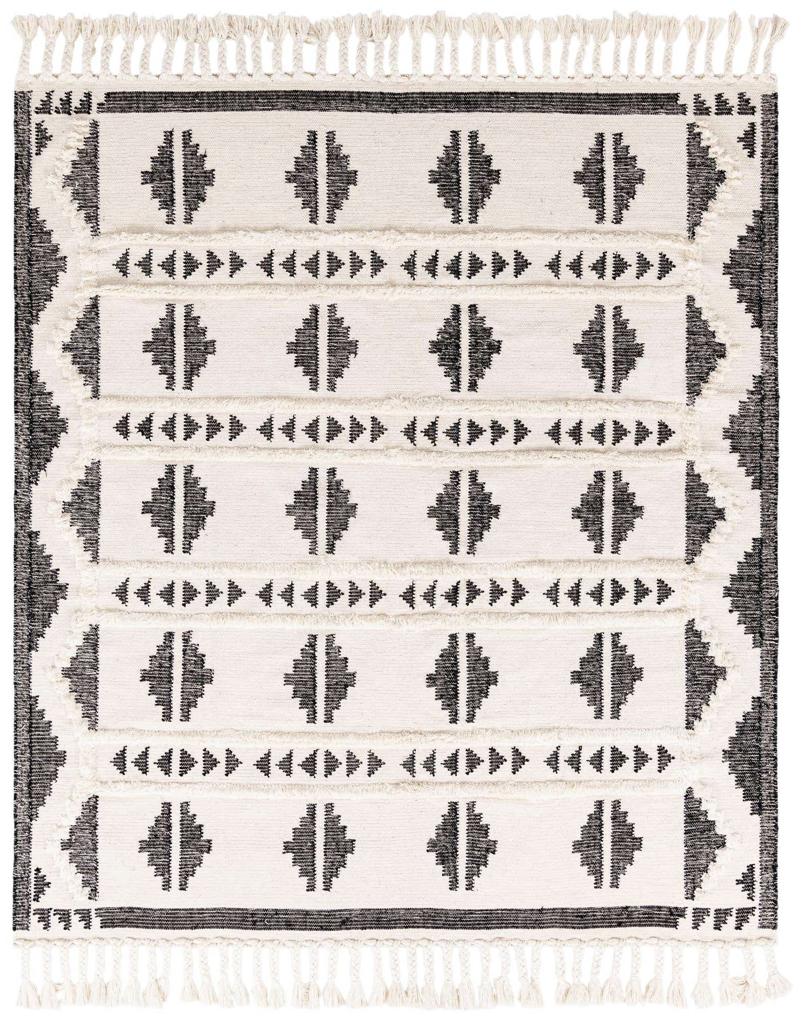 A square 8' x 8' black and white tribal wool shag rug with geometric patterns and fringe.