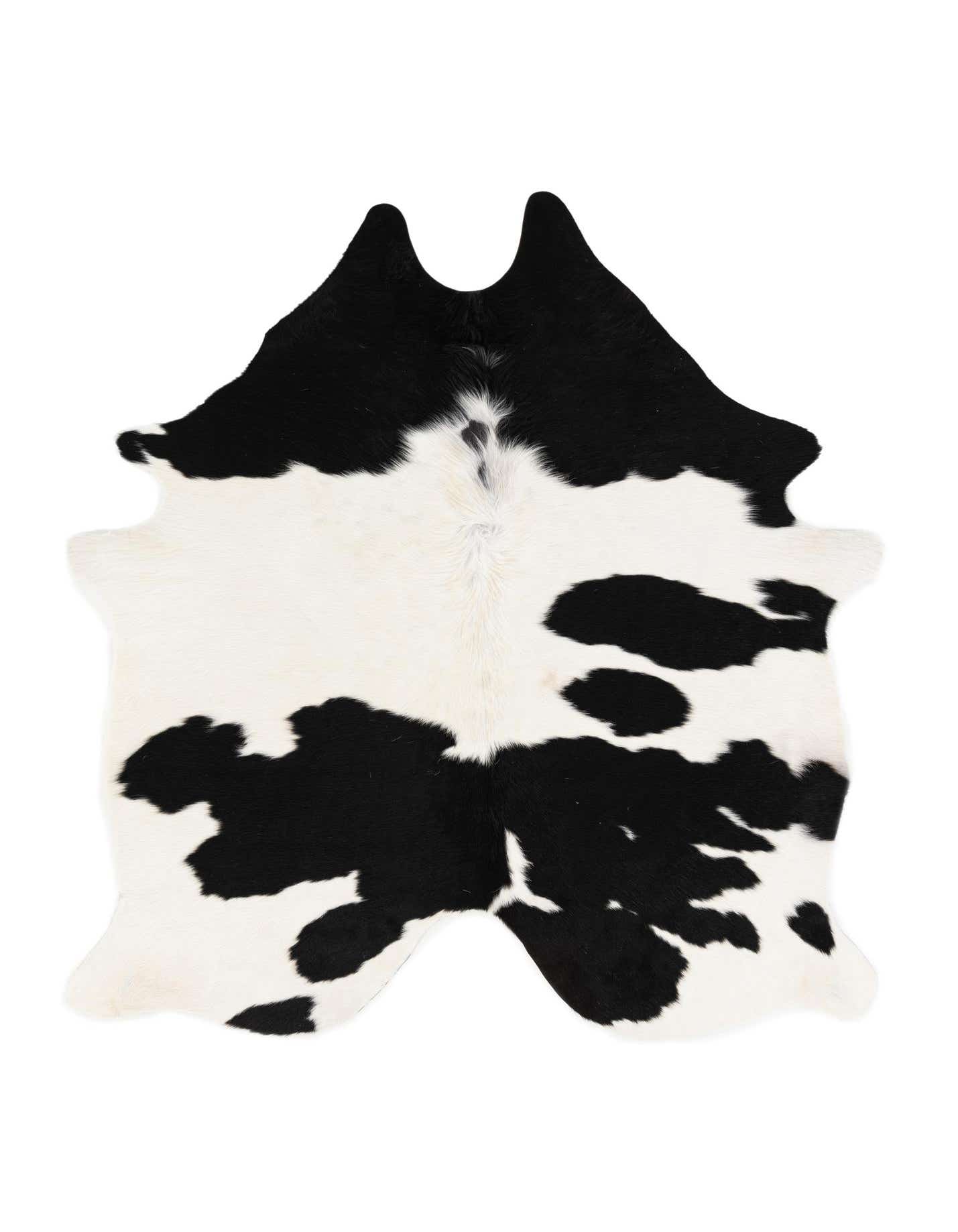 A black and white cowhide leather rug with an irregular, organic shape, showcasing its natural pattern.