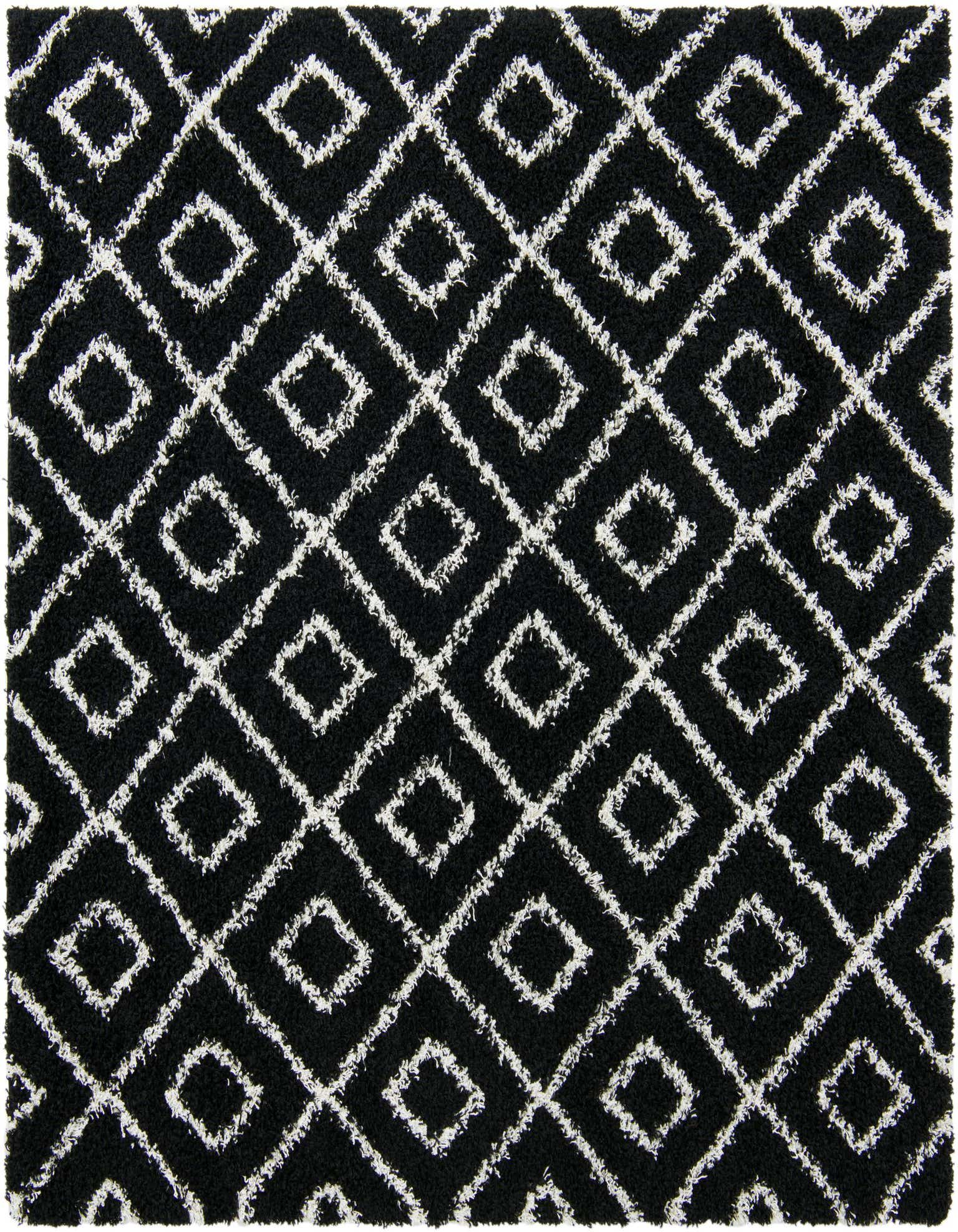 A close-up view of a black and white square area rug featuring a modern trellis pattern with a textured high/low pile.