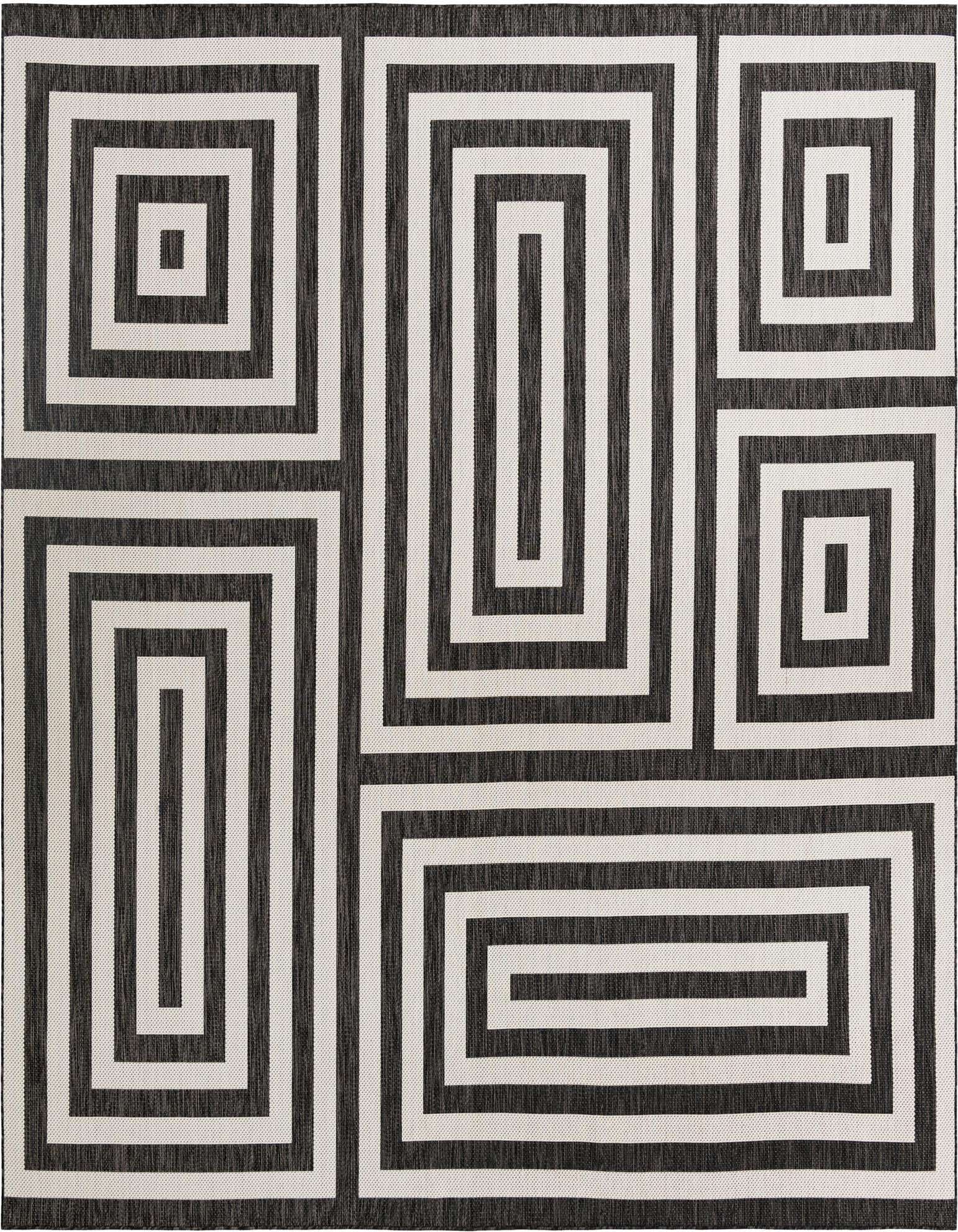 A 12'x12' square black and white modern geometric rug with a bold maze-like pattern, suitable for indoor or outdoor use.