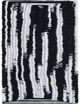 A 1' 2 x 10' 0 black and white braided chindi runner rug with vertical stripes and a textured, flatweave surface.