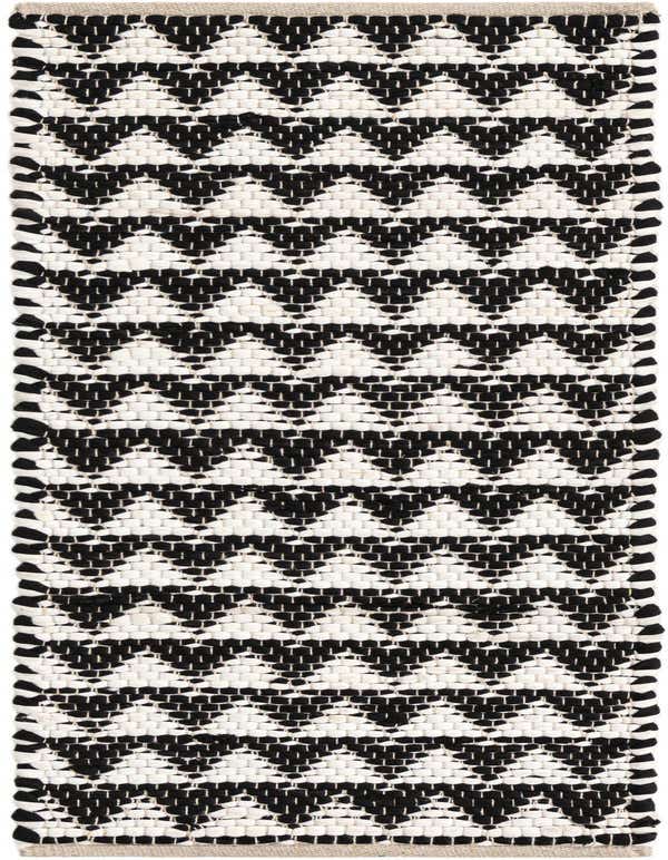 A 1' 2 x 4' 1 Chindi Jute runner rug with a bold black and white abstract zig-zag pattern, ideal for a table or hallway.