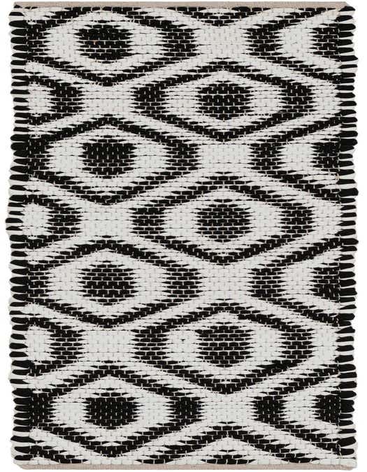 A black and white Chindi Jute runner rug with a bold geometric diamond pattern, perfect for a hallway or kitchen.