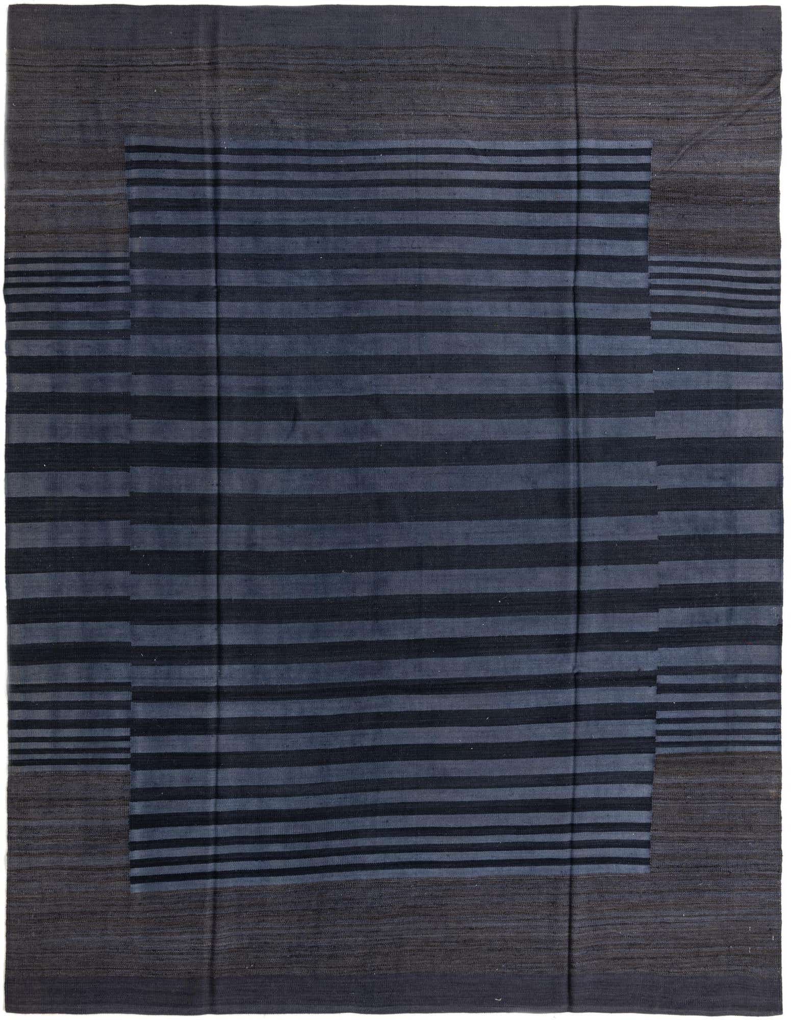 An 8x10 rectangular flatweave wool rug with a modern tribal stripe pattern in varying shades of black and blue.