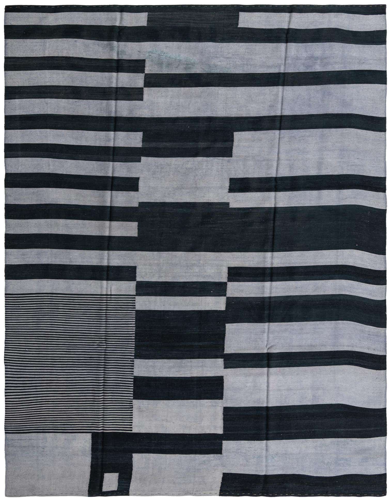 A rectangular 8x11 Kilim Modern rug featuring a bold tribal stripe pattern in varying shades of black and gray.