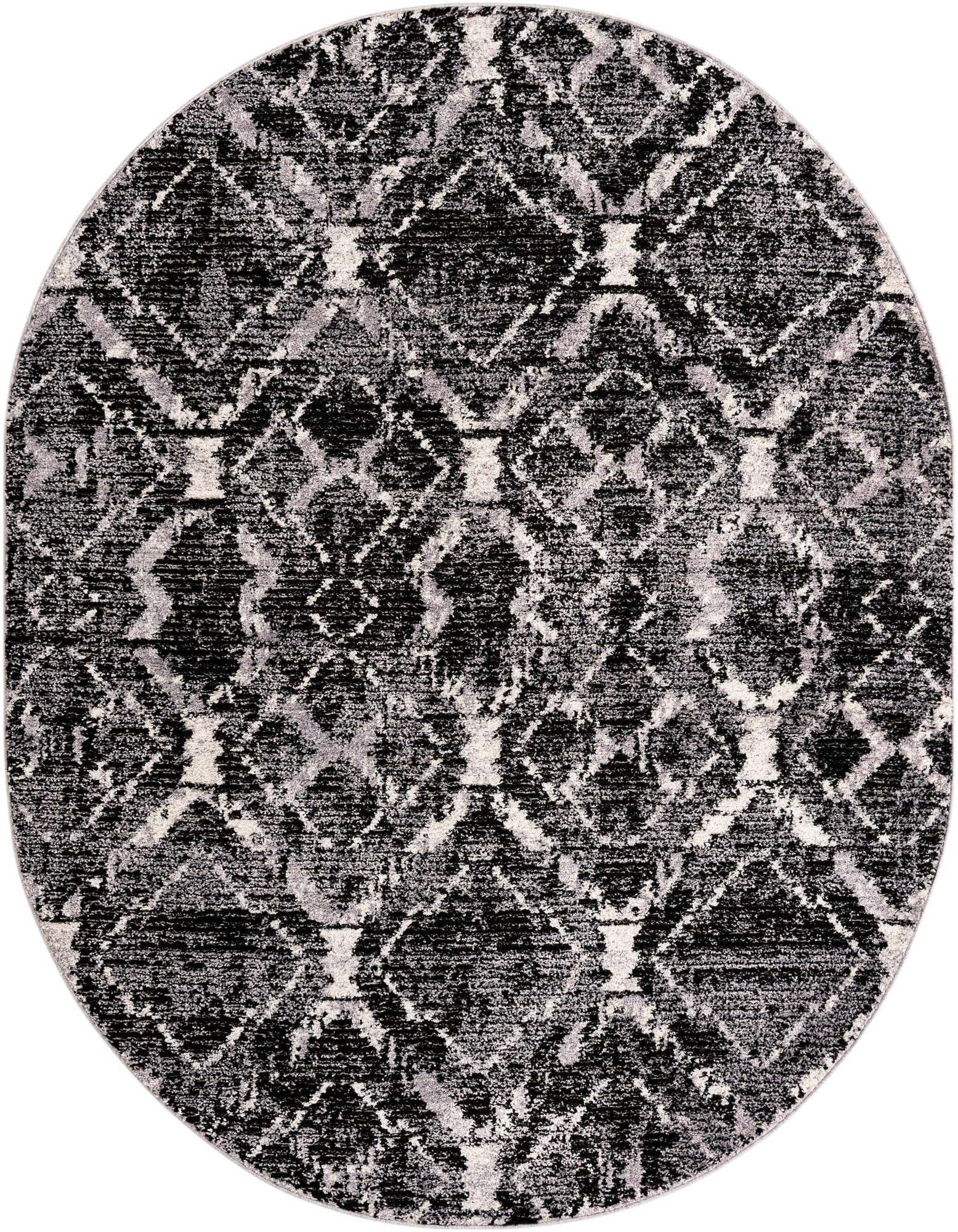 An 8' x 10' oval black and grey modern shag rug with a distressed stripe pattern.