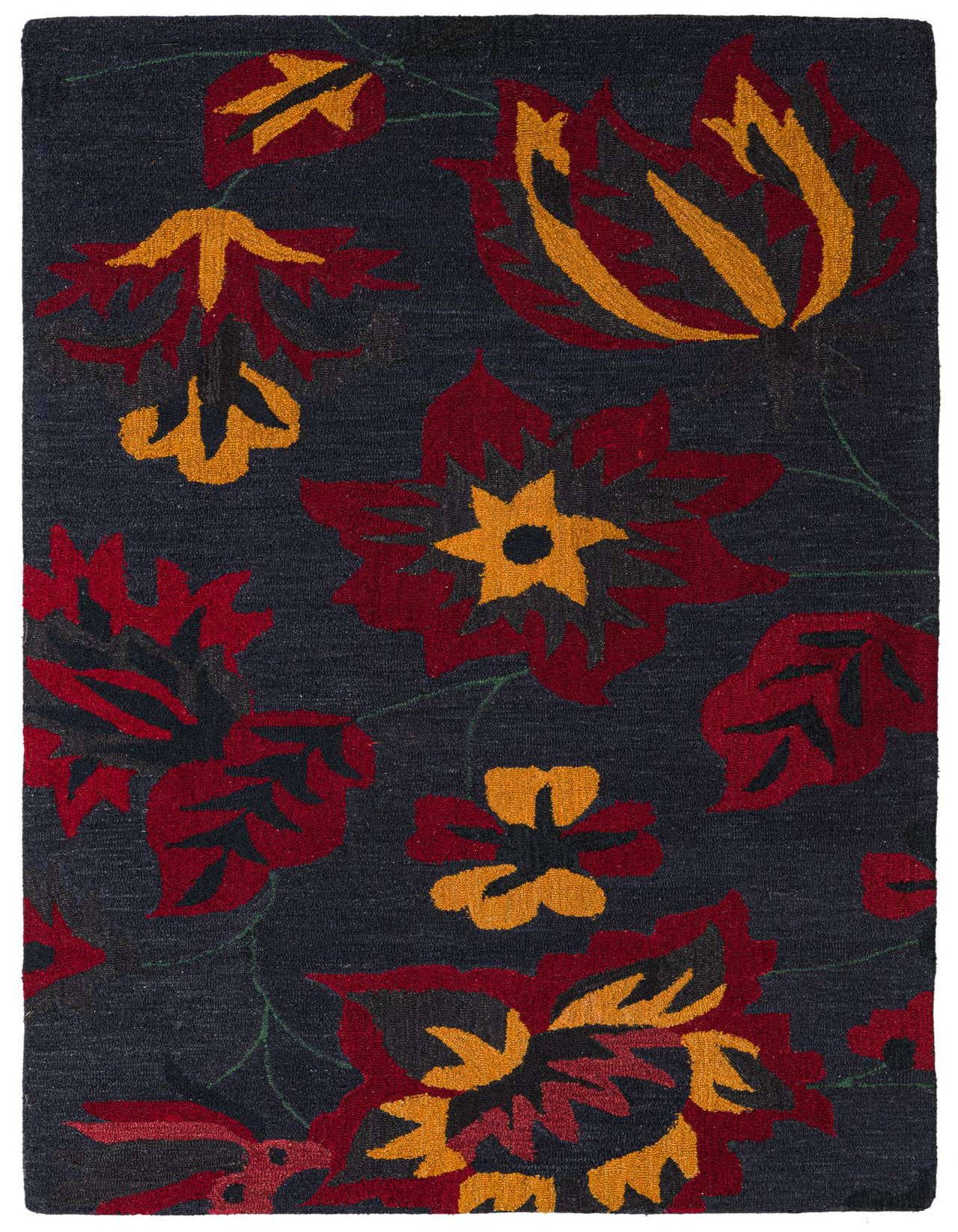 A 5x8 rectangular black wool rug with a vibrant traditional floral pattern in red, gold, and dark gray.