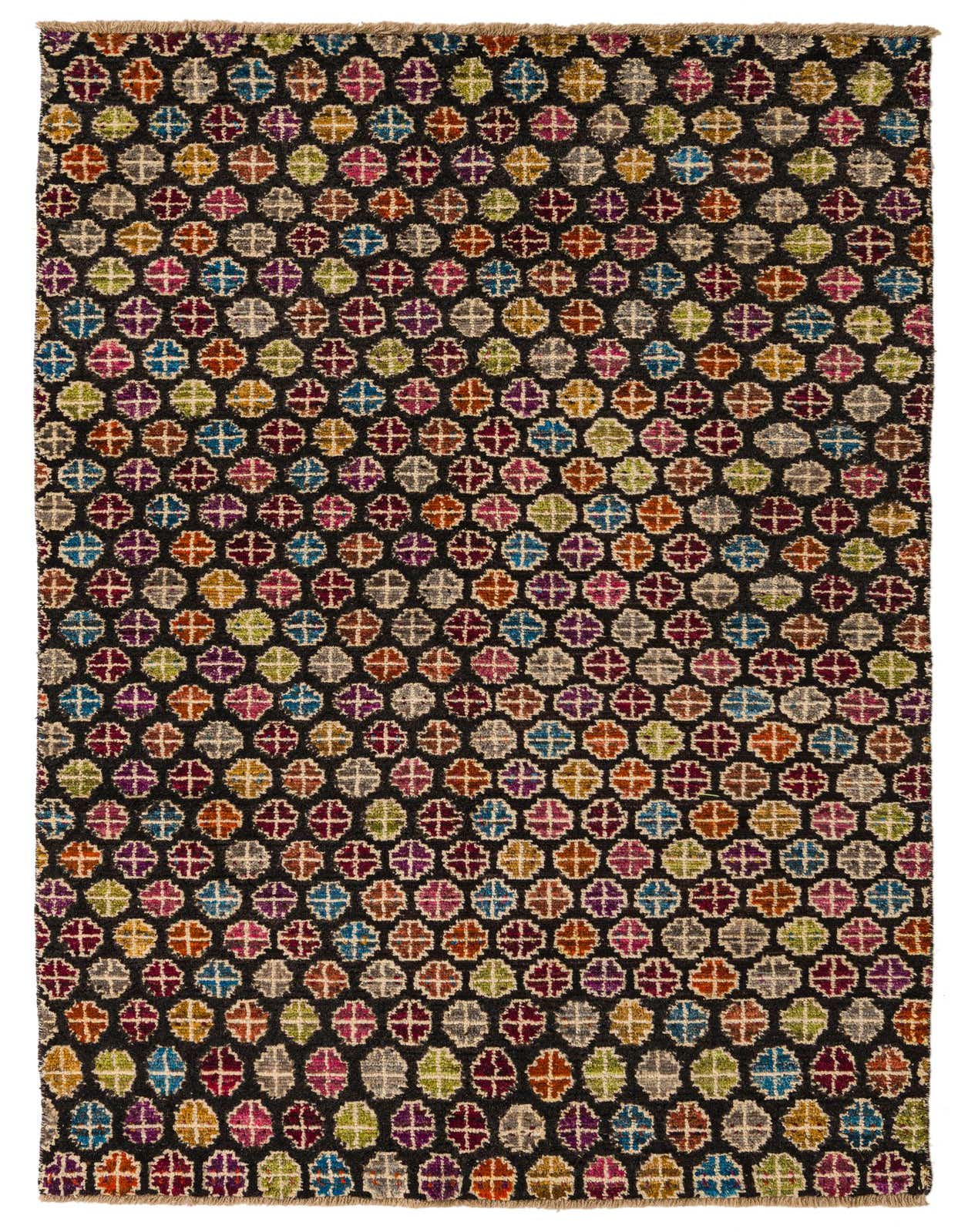 A 5x8 rectangular black wool rug featuring a vibrant, repeating tribal abstract pattern of colorful circular motifs, ideal for a living room.