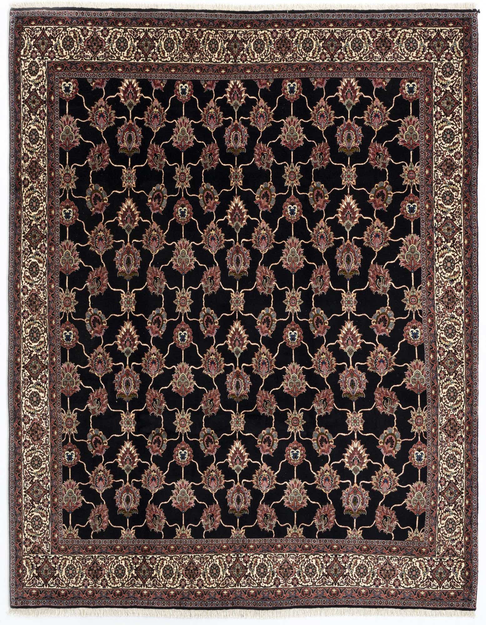 An 8x10 rectangular black Persian wool rug with intricate floral motifs and a detailed border.