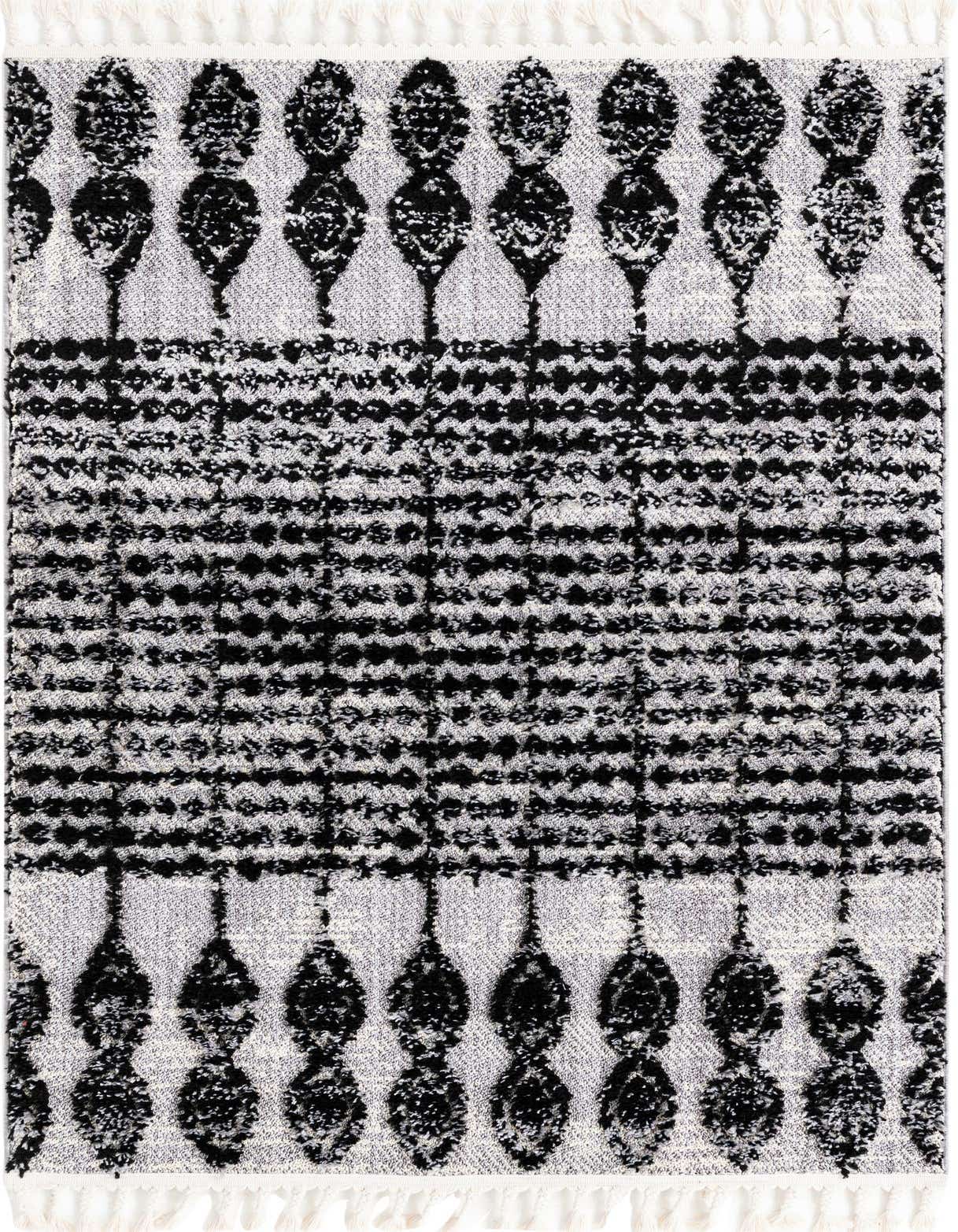 A 4x6 rectangular Rugs.com Cherokee rug featuring a black and white tribal pattern with textured pile and white tassels.