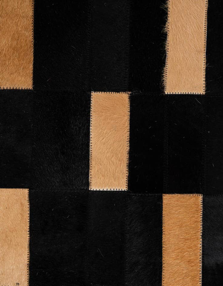 Detail image of  5' 1 x 7' 11 Cowhide - Patchwork Rug