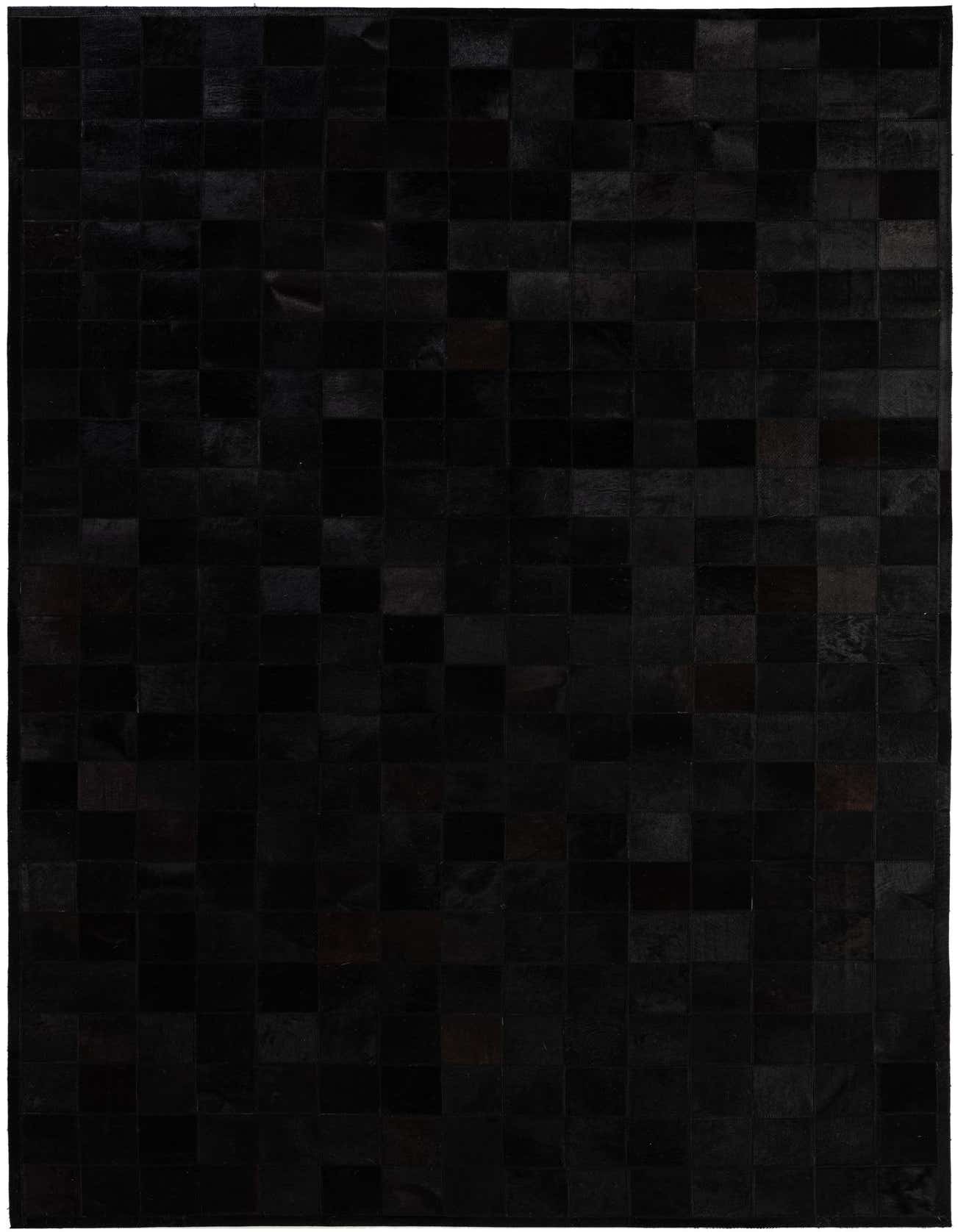 A 5x8 rectangular black cowhide patchwork rug with a modern design, suitable for a living room.