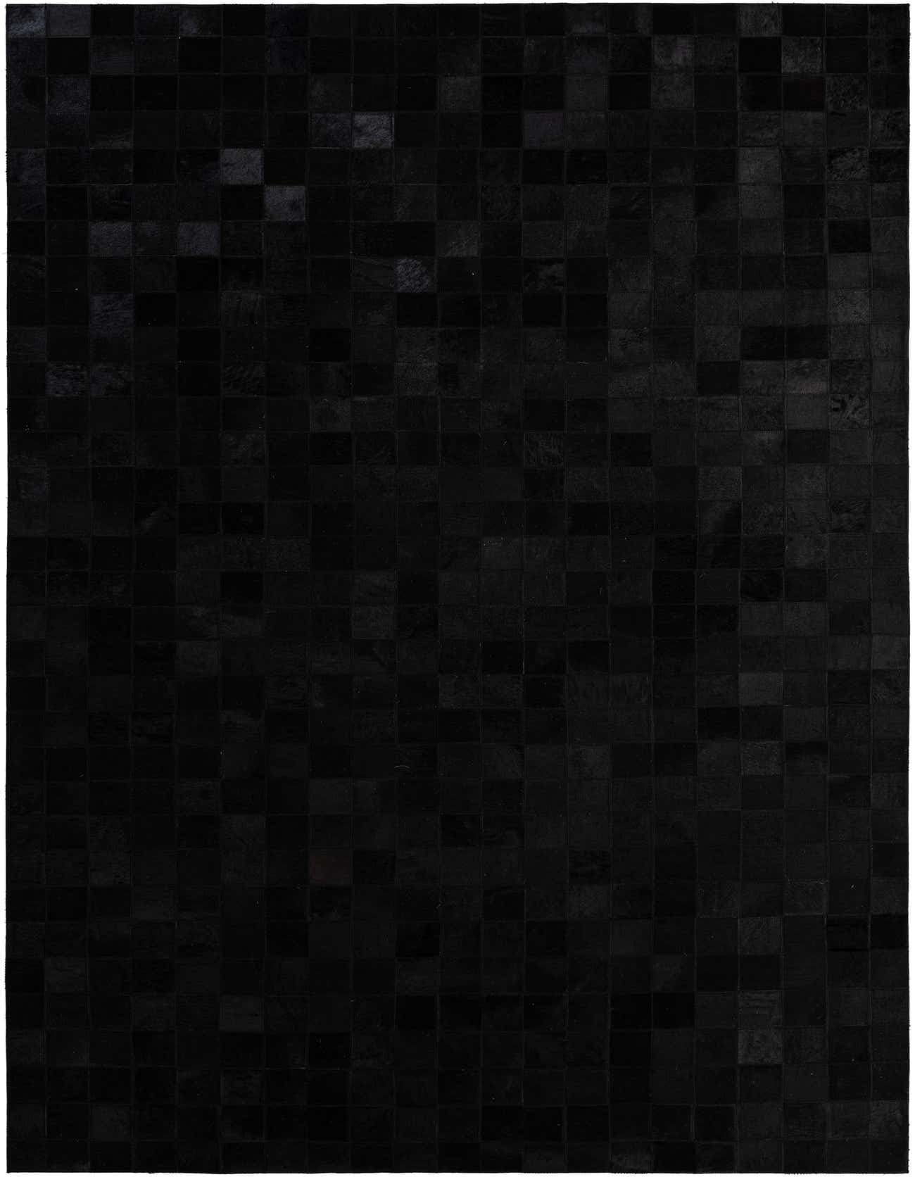 A 5x8 rectangular black modern rug made from cowhide and leather, featuring a patchwork design.