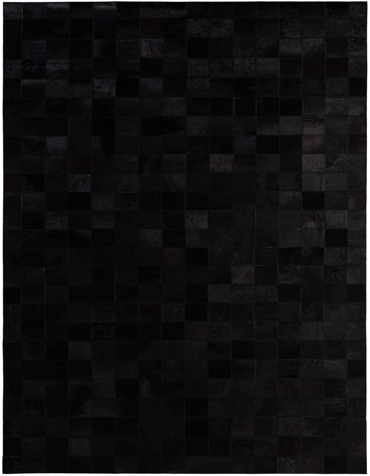 A 5x8 rectangular black cowhide rug with a modern patchwork pattern, suitable for a living room or bedroom.