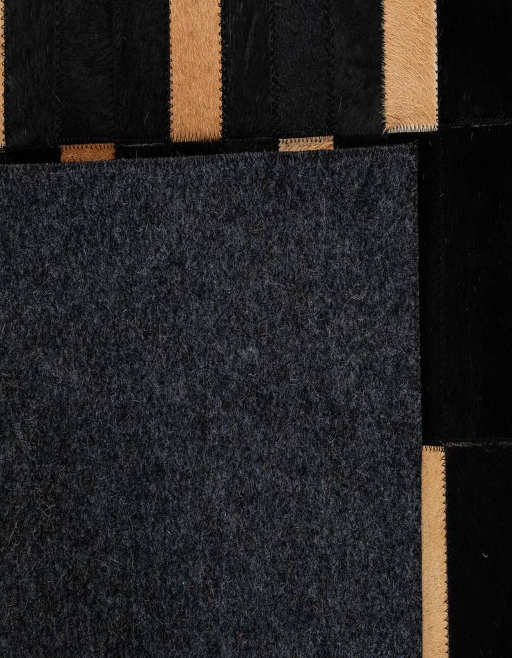 Detail image of  5' 1 x 7' 11 Cowhide - Patchwork Rug
