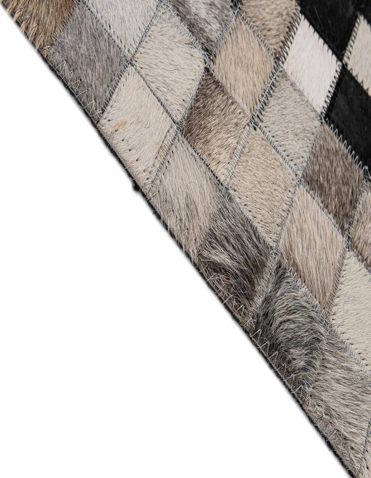 Detail image of  5' 2 x 7' 11 Cowhide - Patchwork Rug