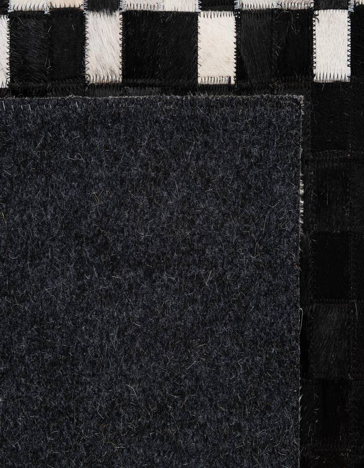 Detail image of  5' 2 x 7' 11 Cowhide - Patchwork Rug