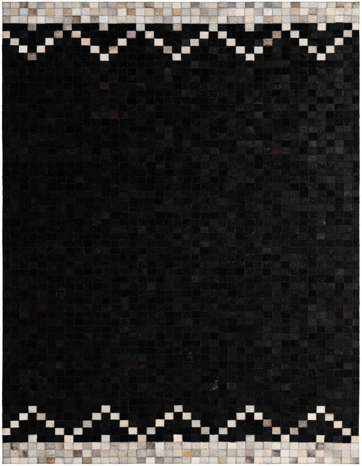 A 5x8 rectangular black cowhide rug with a modern patchwork design and light grey, white, and tan geometric borders.