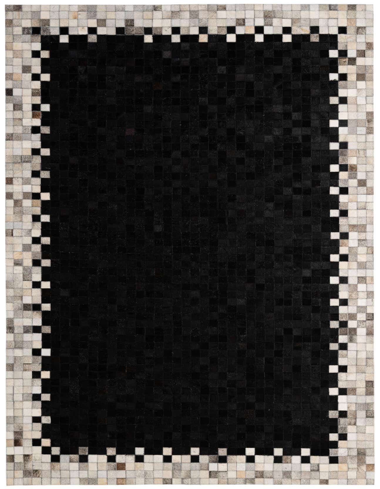 A 5x8 rectangular black cowhide rug with a modern patchwork design, featuring a border of mixed light and dark square patches.