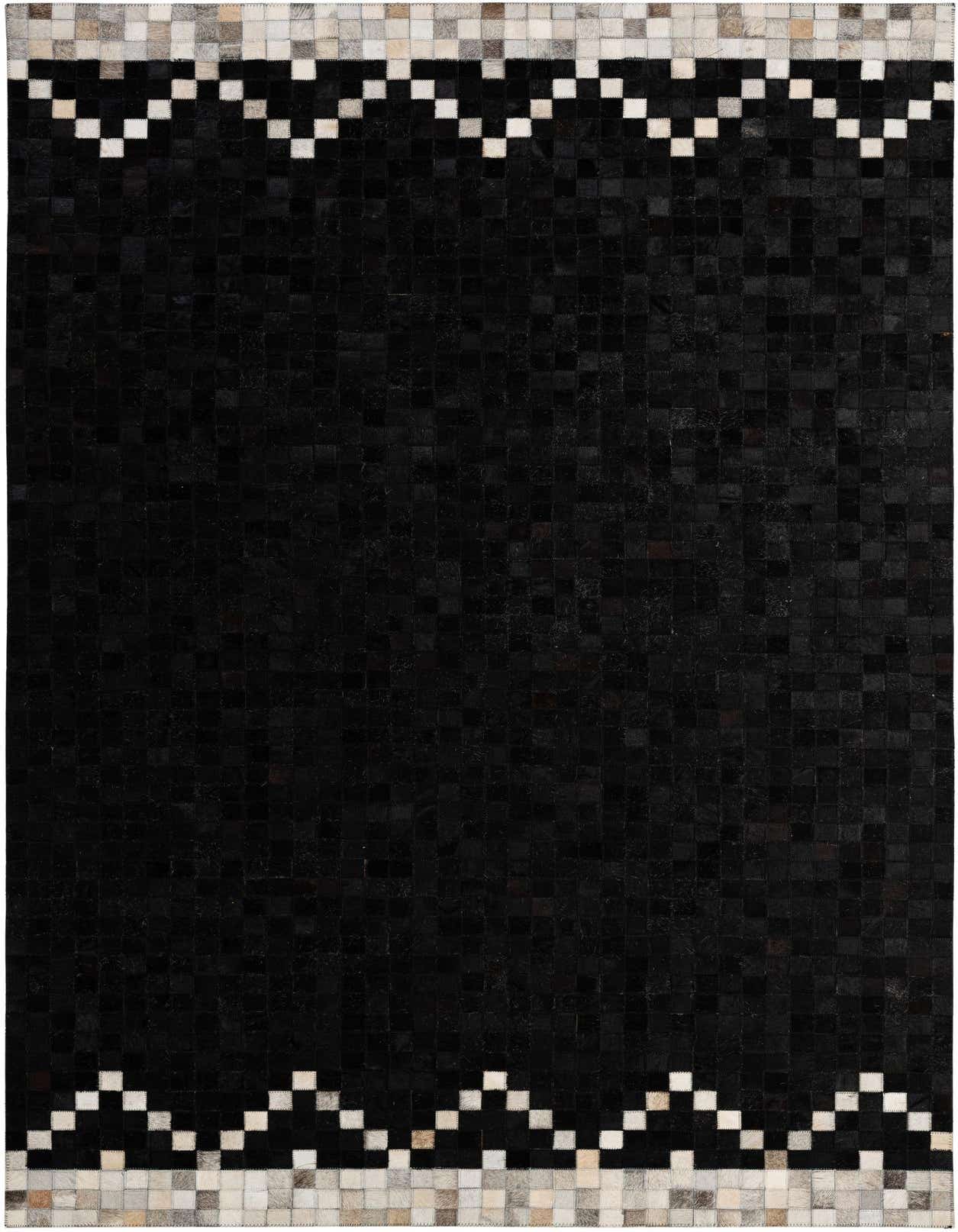 A 5x8 rectangular black cowhide rug with a modern patchwork design and a light grey and white geometric border.