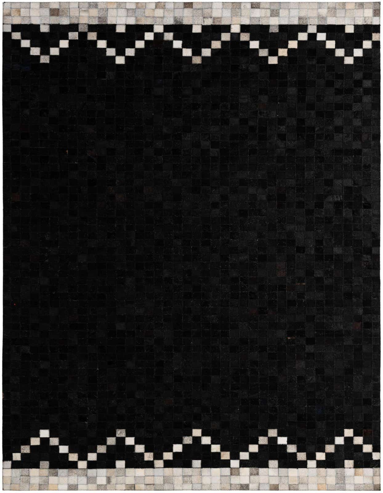 A 5x8 rectangular black cowhide rug with a modern patchwork design and a zigzag border of light and dark squares.