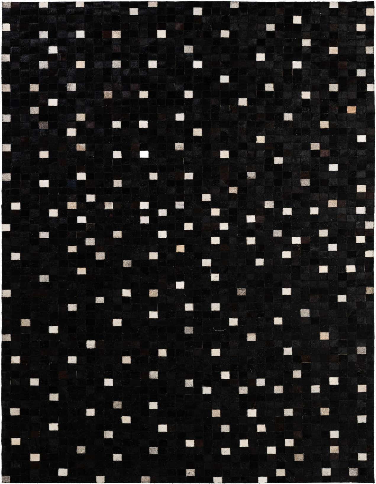 A 5x8 rectangular black cowhide rug with a modern patchwork design featuring scattered white and grey squares.