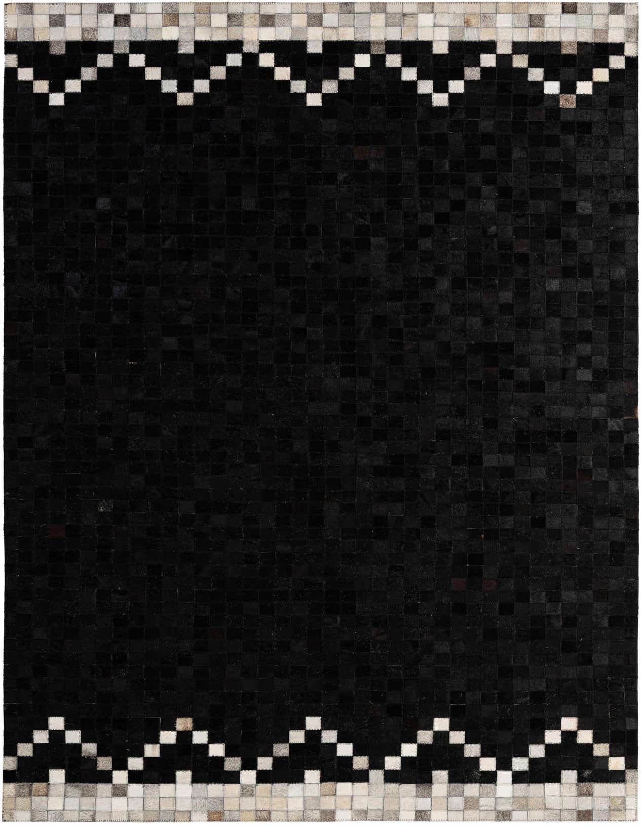 A 5x8 rectangular black cowhide rug featuring a modern patchwork design with a light border.