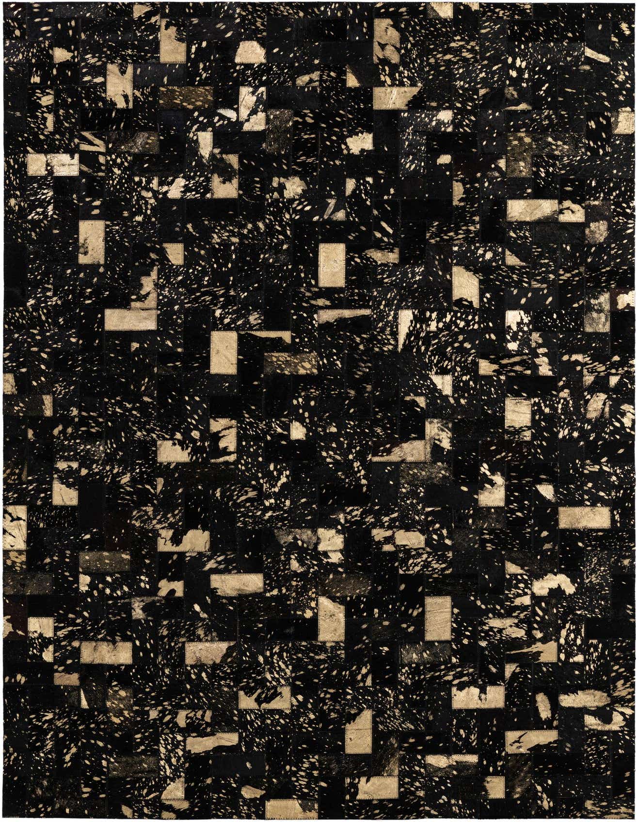 A 4x6 rectangular black and gold modern cowhide patchwork rug with a splattered paint pattern, ideal for a living room.