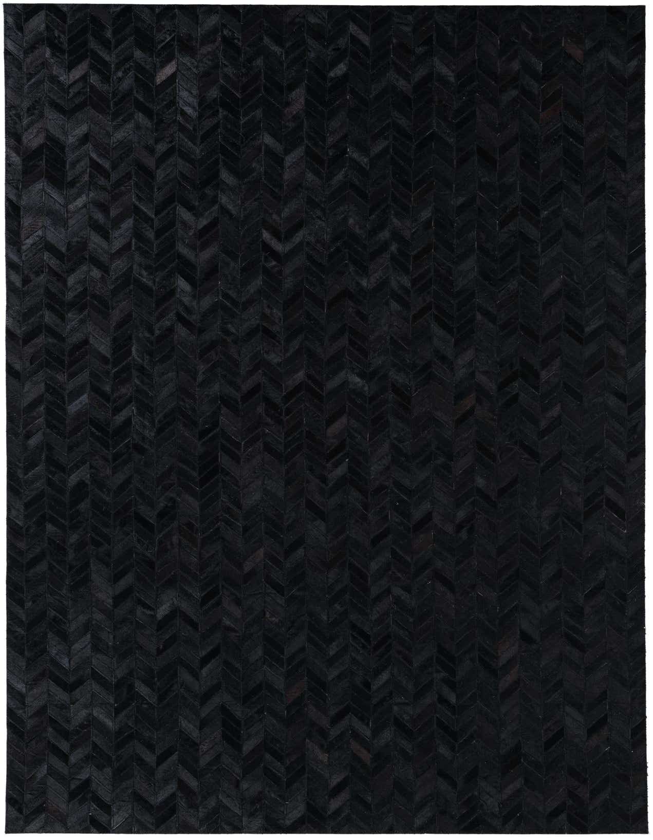 A 5x8 rectangular black cowhide leather rug with a modern chevron pattern, ideal for a living room.