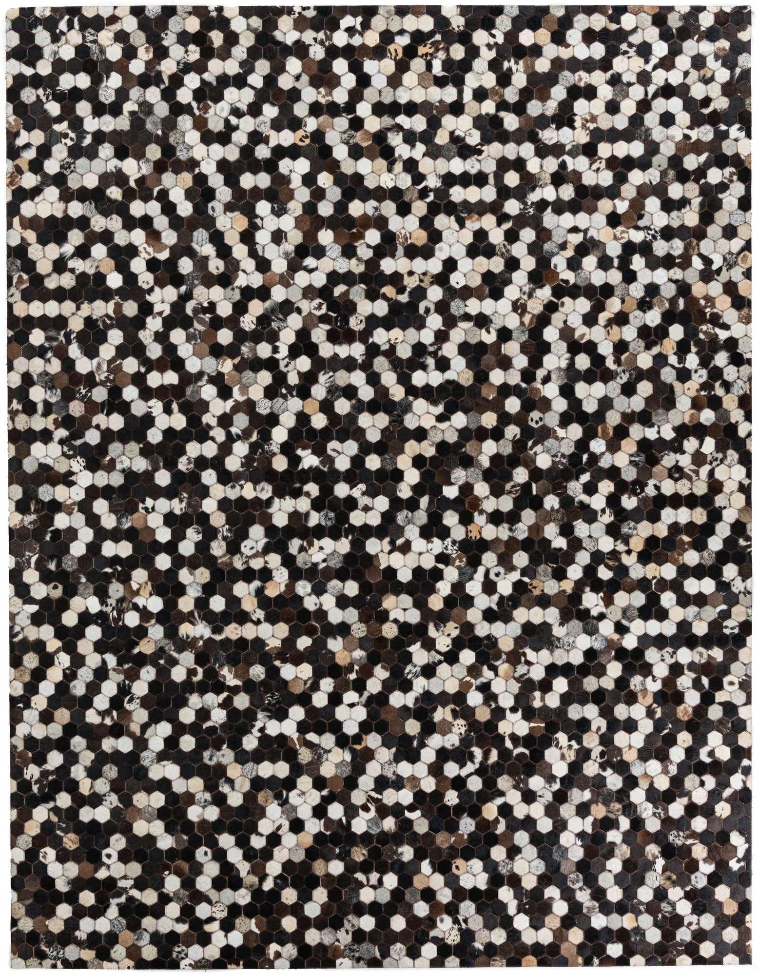 A rectangular 8x10 black modern cowhide rug with a mosaic pattern of small hexagonal leather patches in varying shades of black, white, and brown.
