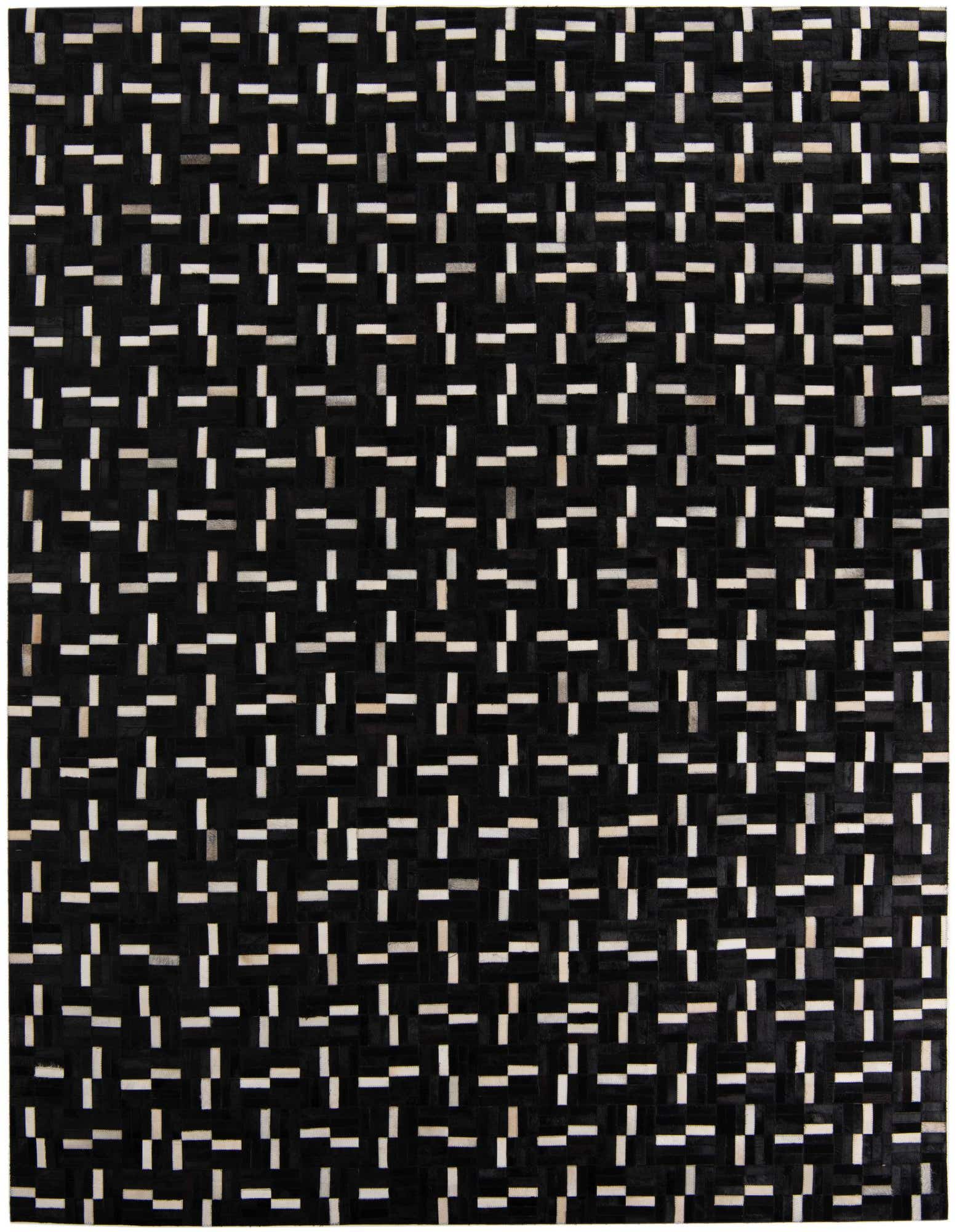 A rectangular 8x10 black cowhide and leather rug with a modern abstract pattern of white and light brown dashes.