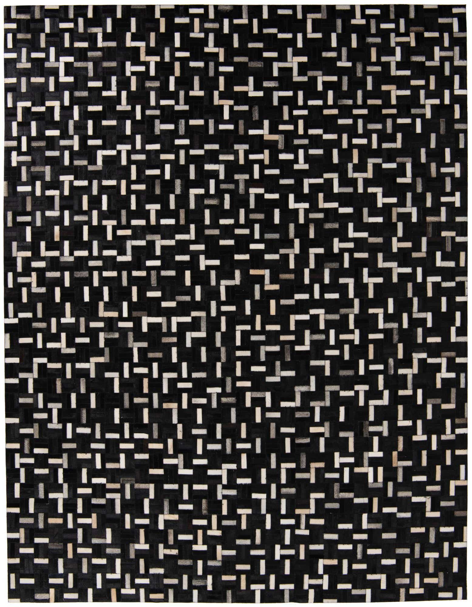8x10 rectangular black cowhide rug with a modern abstract pattern of white, grey, and tan leather pieces.