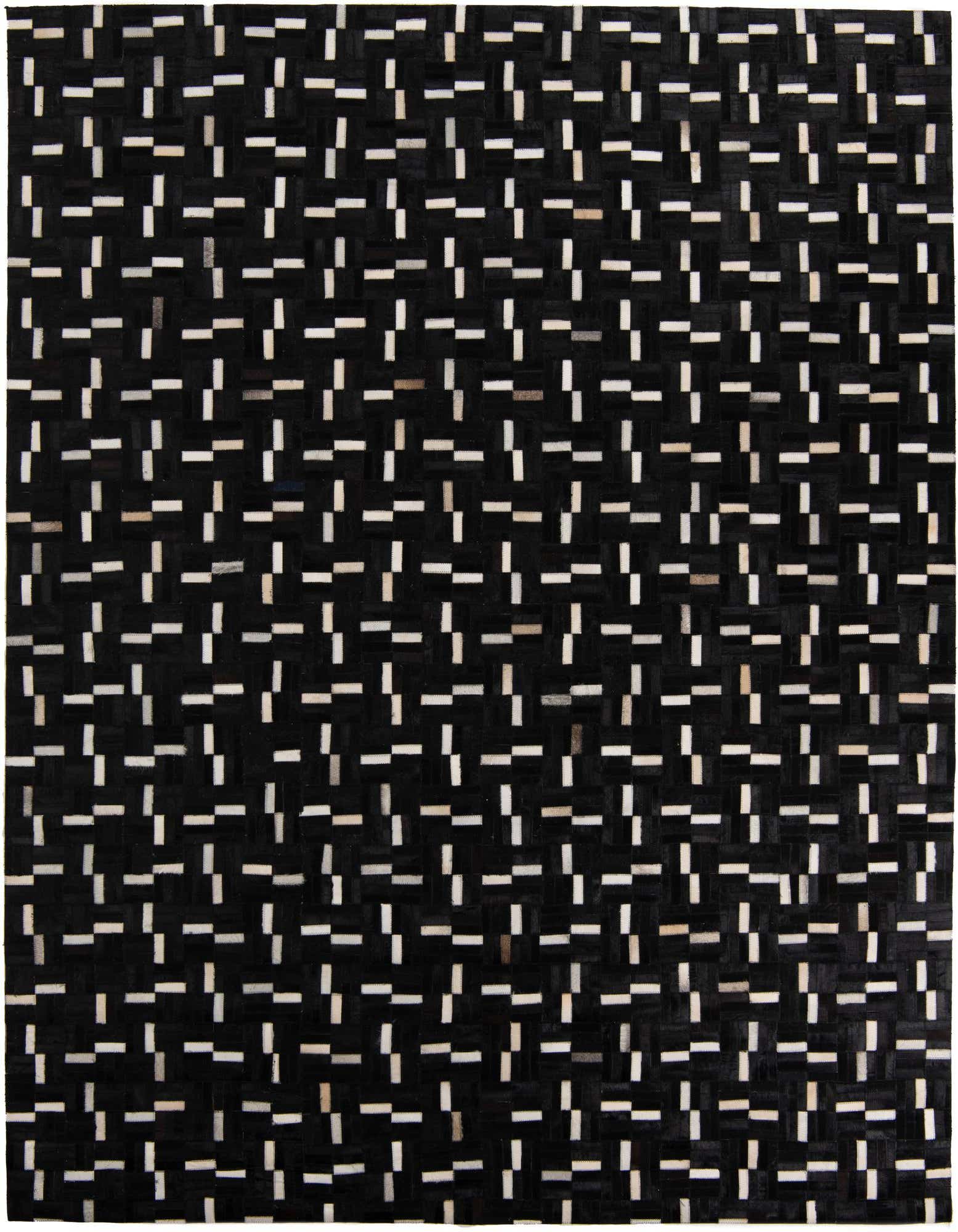 A rectangular 8x10 black cowhide rug with a modern stripe pattern made of small, alternating black and off-white leather rectangles.