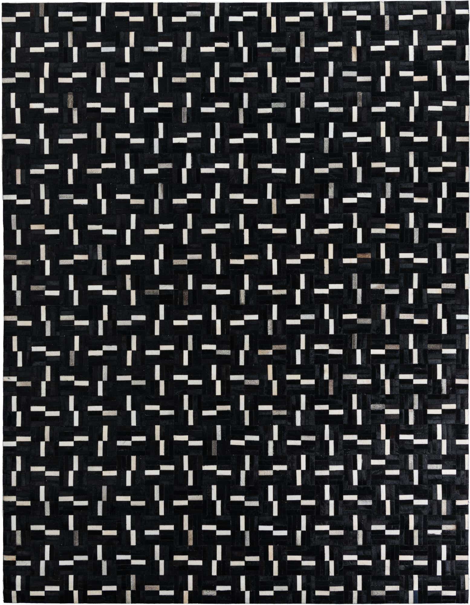 A rectangular 8x10 black cowhide rug with a modern stripe pattern, featuring small white and gray rectangular patches.